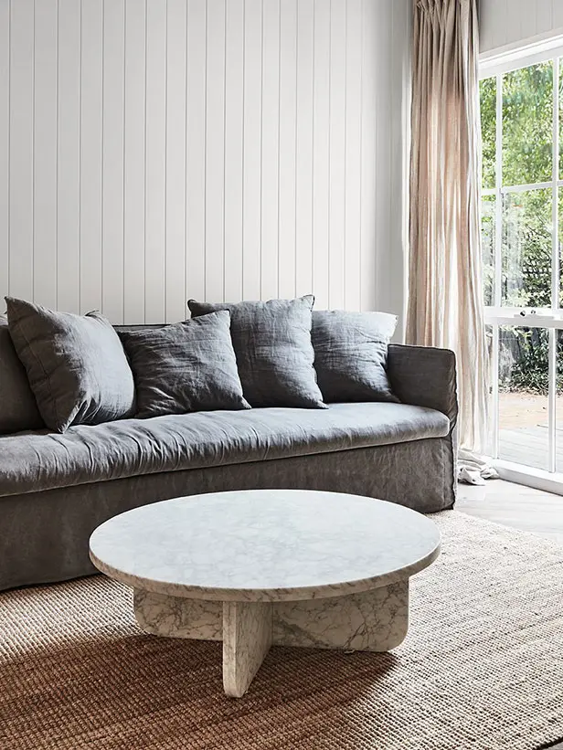 White living room with grey couch