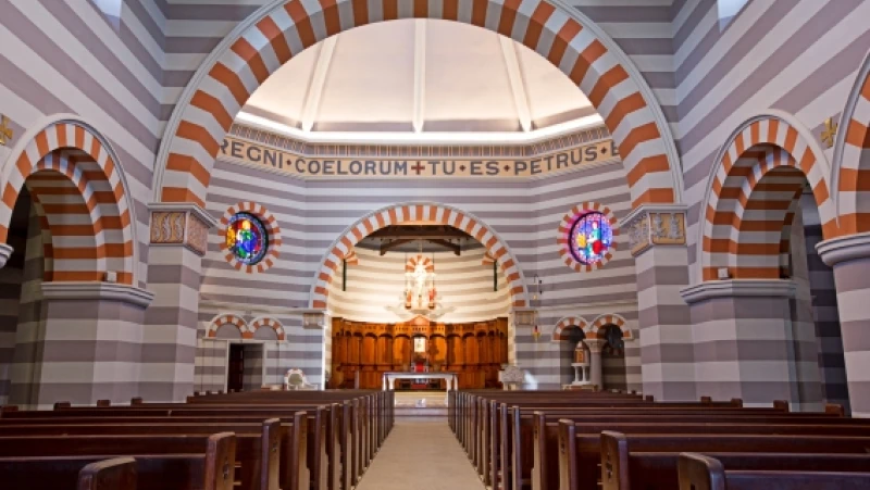 Neutral and orange striped church apse and altar