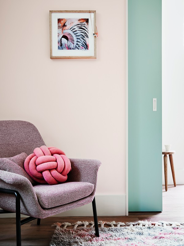 Popular Interior Trends grey chair with pink cushion