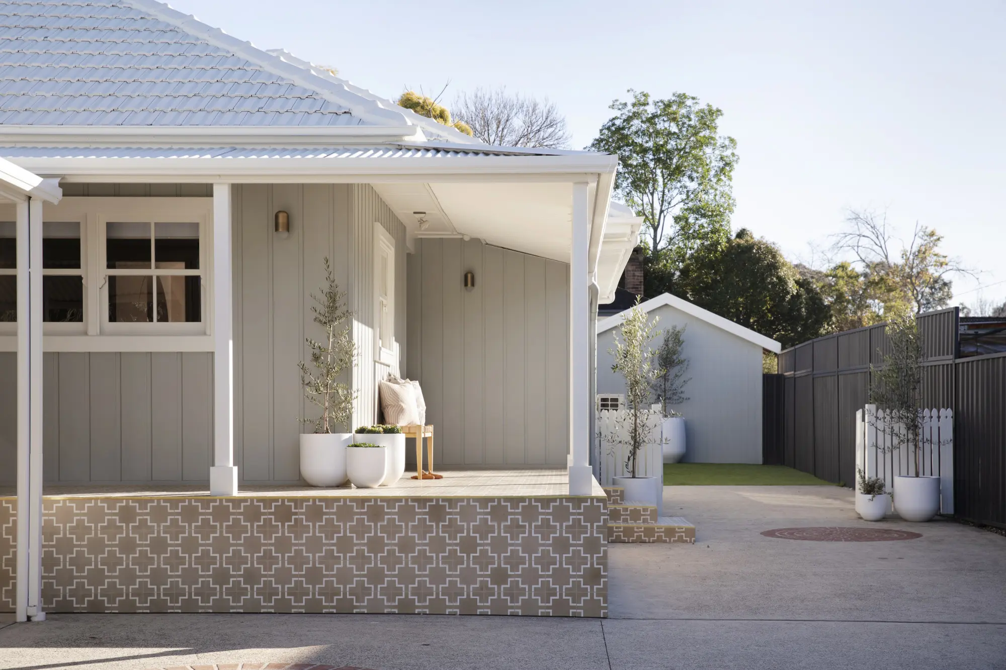 Front wrap around verandah with tiled floors, walls painted in Dulux Pozieres and trims painted in Dulux White Dune.