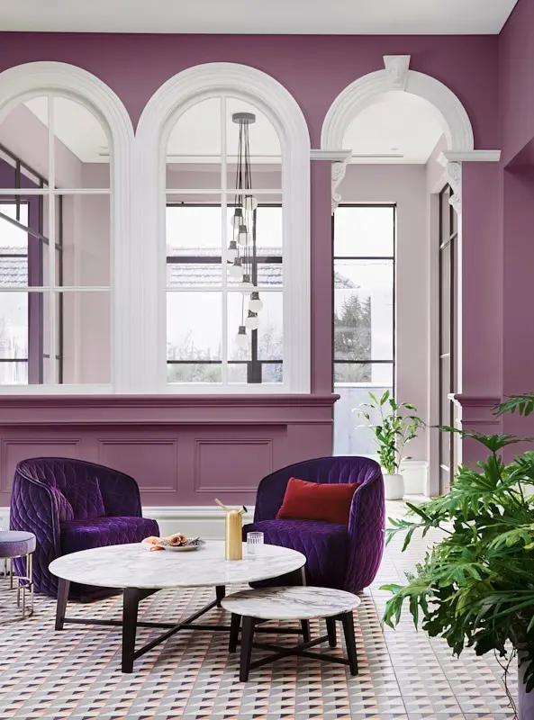 Purple wall with purple chairs