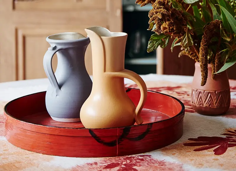 interior decor close up red tray and jugs.