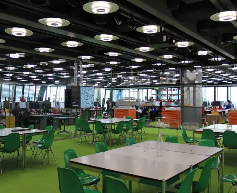 interior office space with green chairs and flooring.