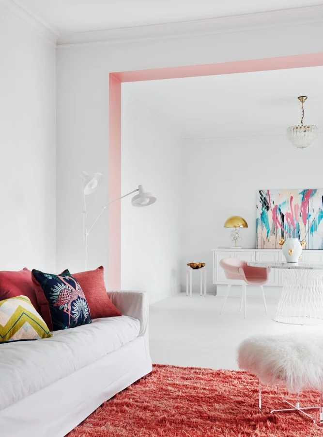 White living room with pink divide