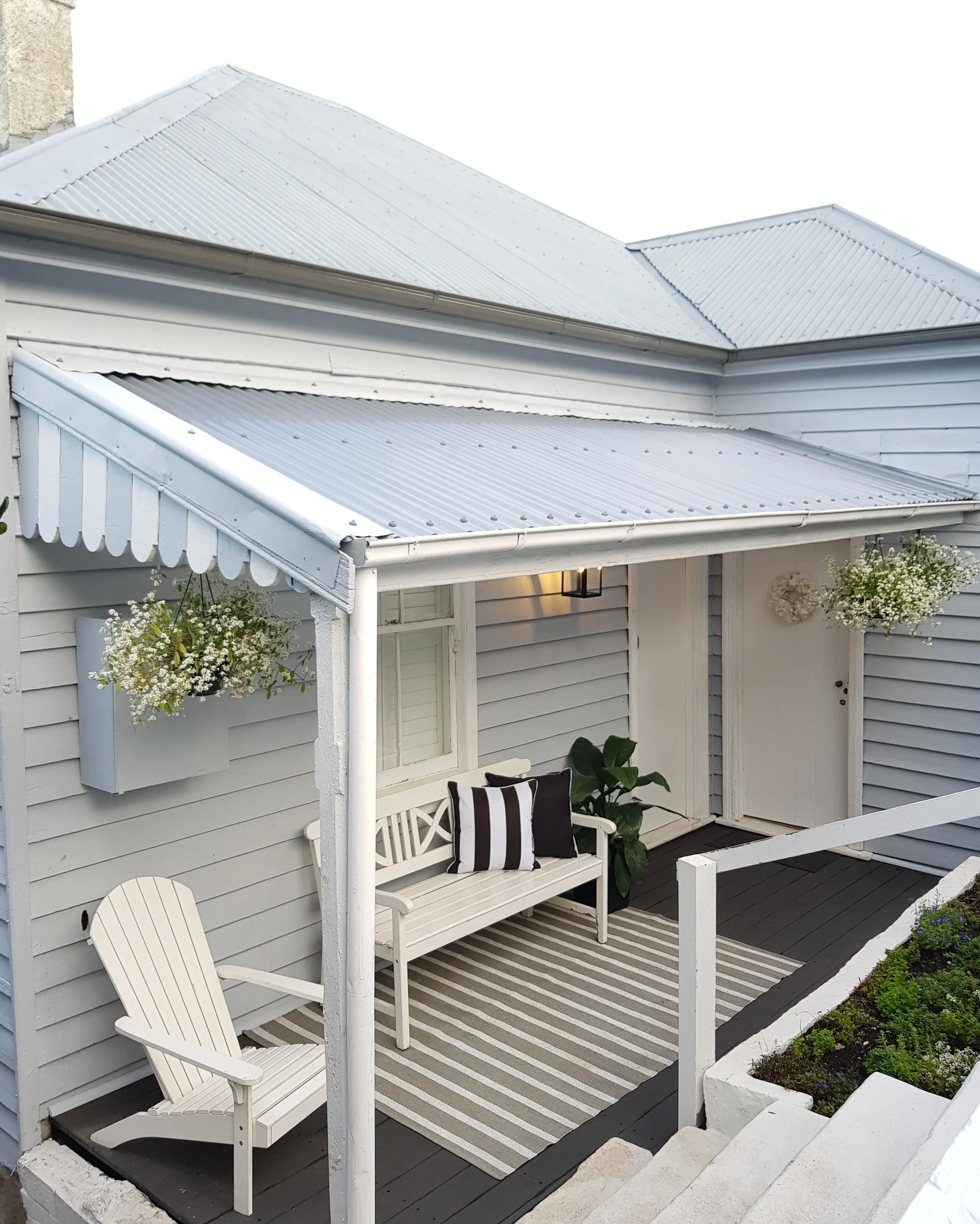 White and light grey weatherboard house
