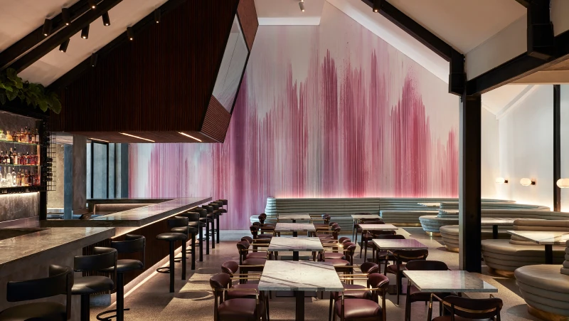 large restaurant with feature wall of different shades of pink