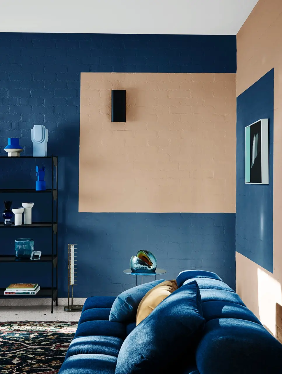 Blue interior living room with painted brick and blue lounge