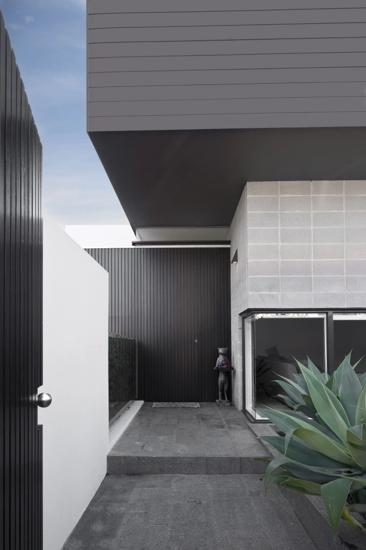 Contemporary exterior with grey fence