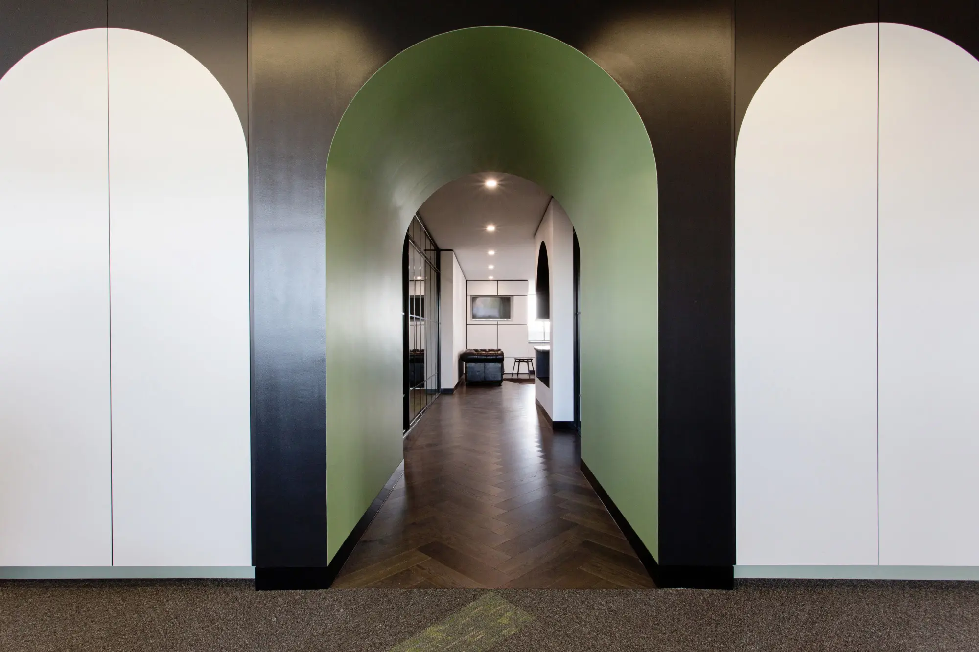 black archway and green hallway 