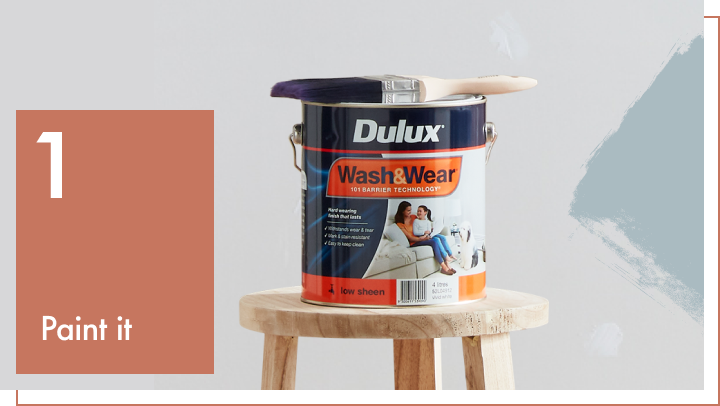 Dulux paint can on stool.
