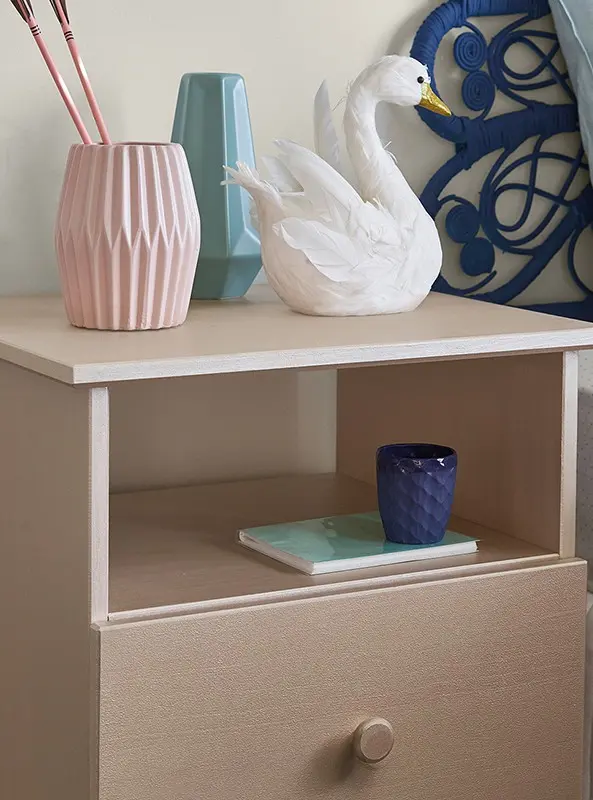 interior tween room bedside table with swan.