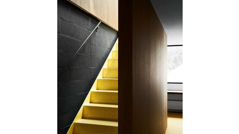 Black wall and yellow steps.