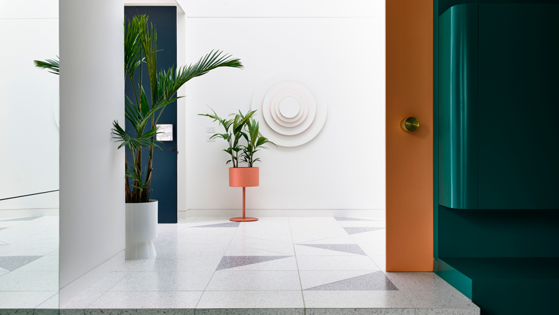 Modern entry with terrazzo floors, white walls