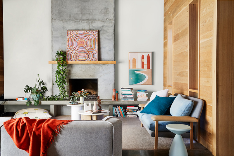 interior lounge room wood and concrete fireplace. 