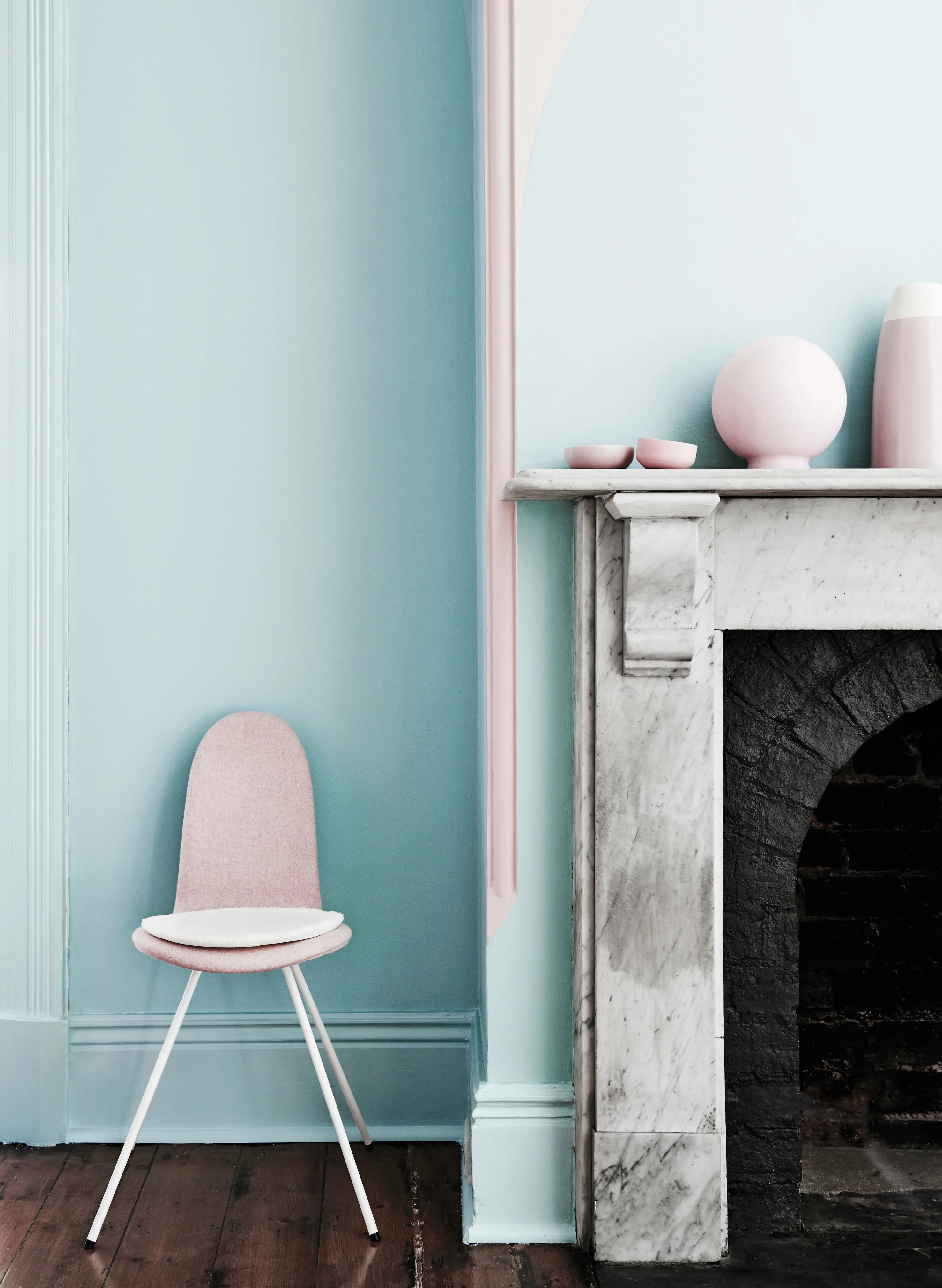 Pastel blue living room with fireplace and white marble mantle