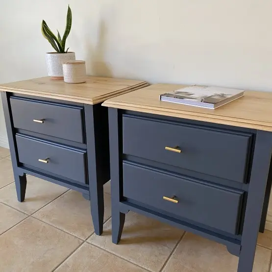 Pair of grey bedside drawers with timber tops.