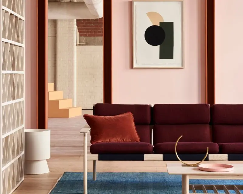 view of red couch in pink living room 