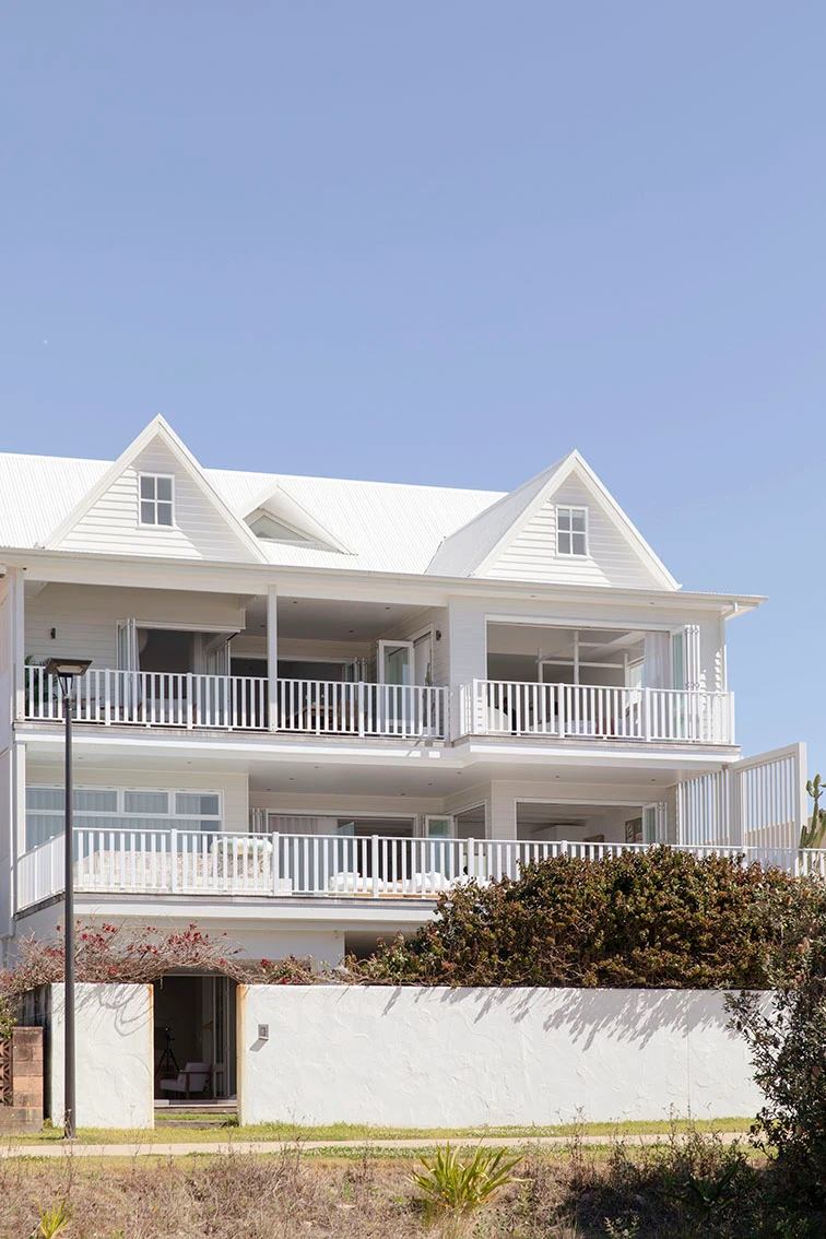 Triple storey beach house in cream and white