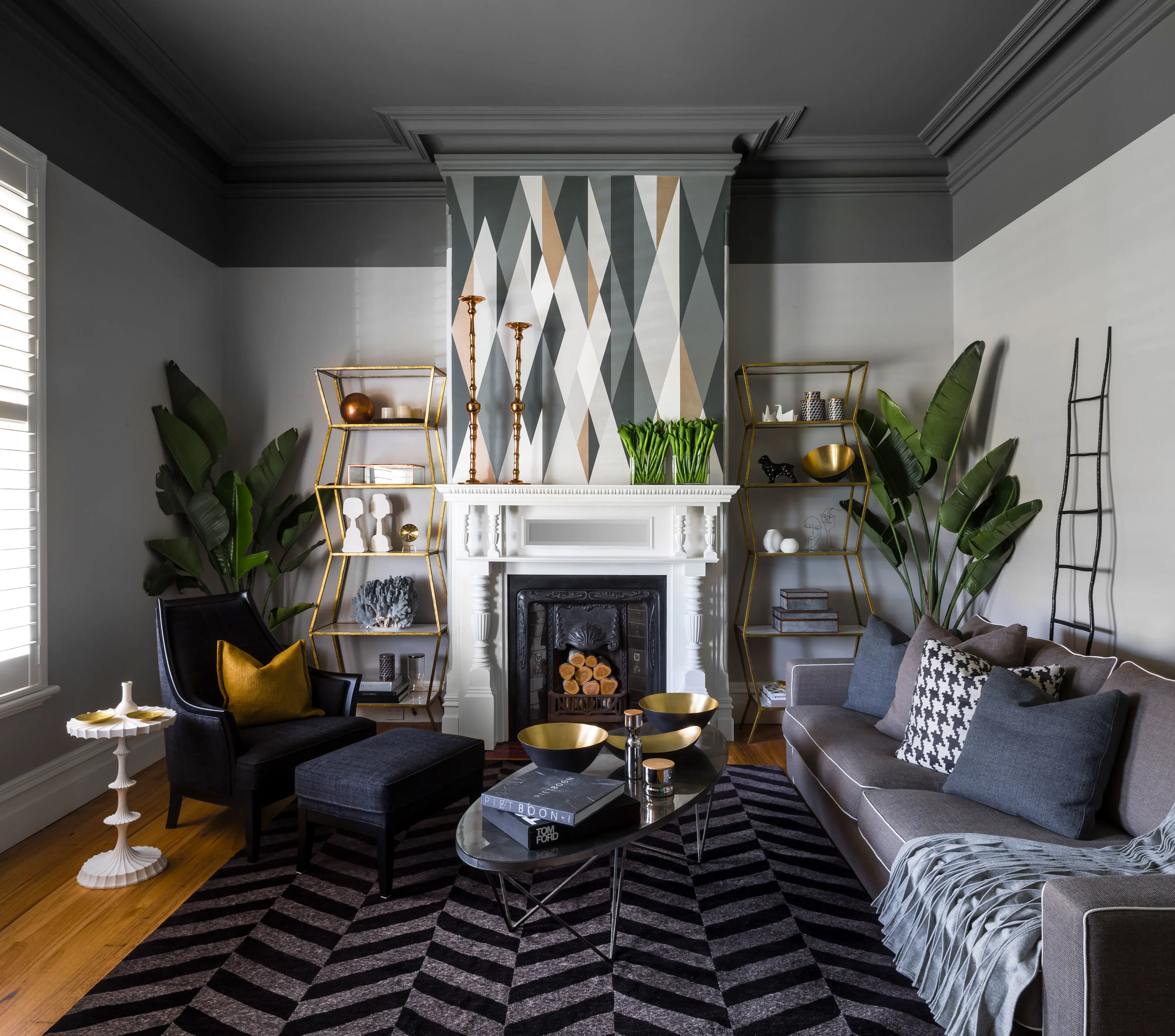 Two-tone grey traditional living room with geometric patterned chimney breast