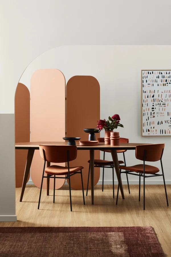 White dining room with orange wall divider