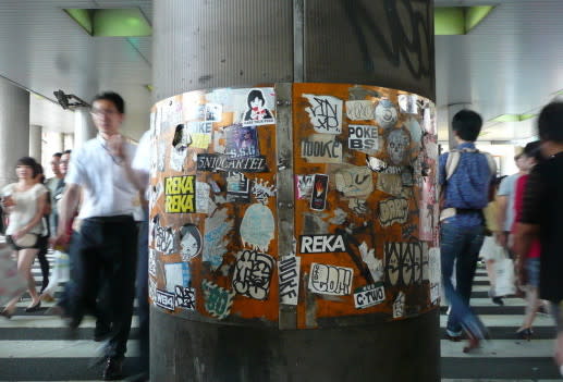 Alive Not Dead vs. BNE in Tokyo, Various stickers on the ba…