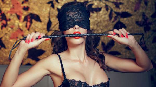 blindfold lady with whip