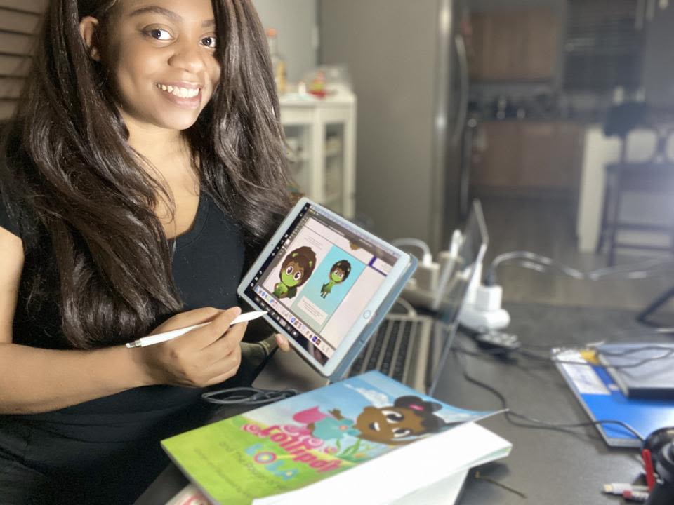 Kiva U.S. borrower, Kiki, designing her doll and book