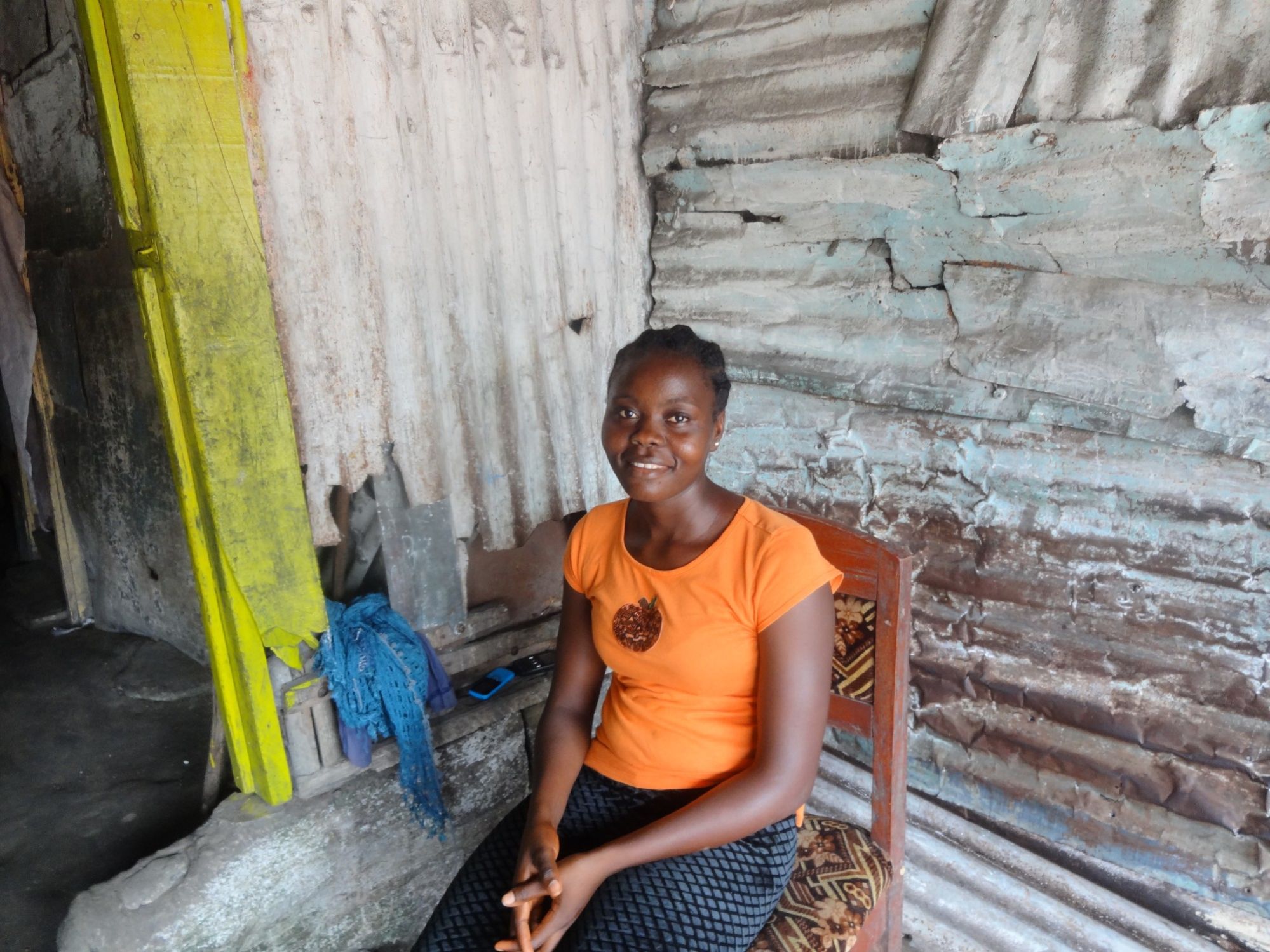 SATTA, AN ENTREPRENEUR FROM LIBERIA, WAS ABLE TO STOCK MORE FOOD TO SELL IN HER STORE WITH HER KIVA LOAN.

