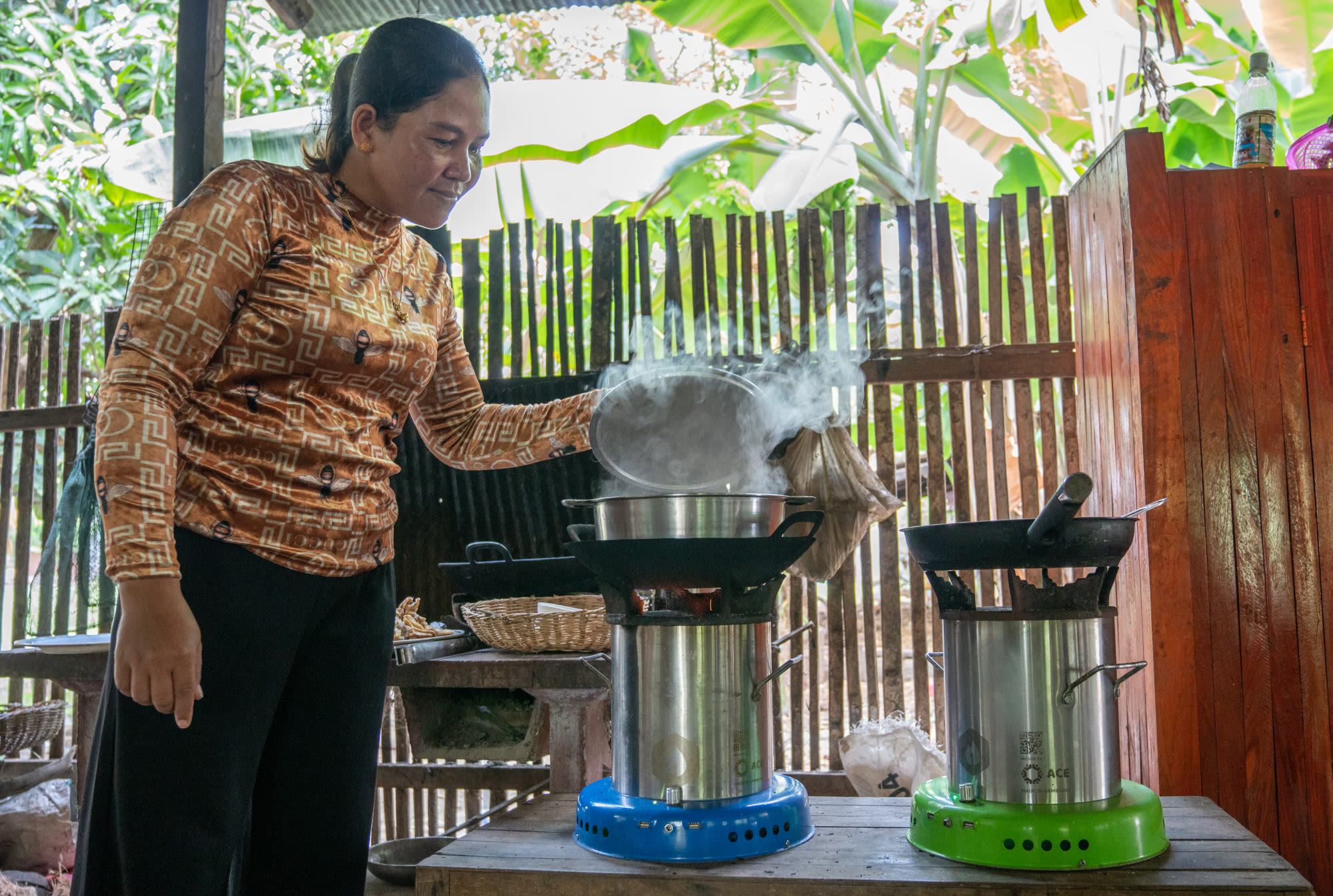 THACH USES HER CLEAN COOKSTOVE TO PREPARE DINNER FOR HER FAMILY.
