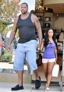 Shaq holding hands with wife photo