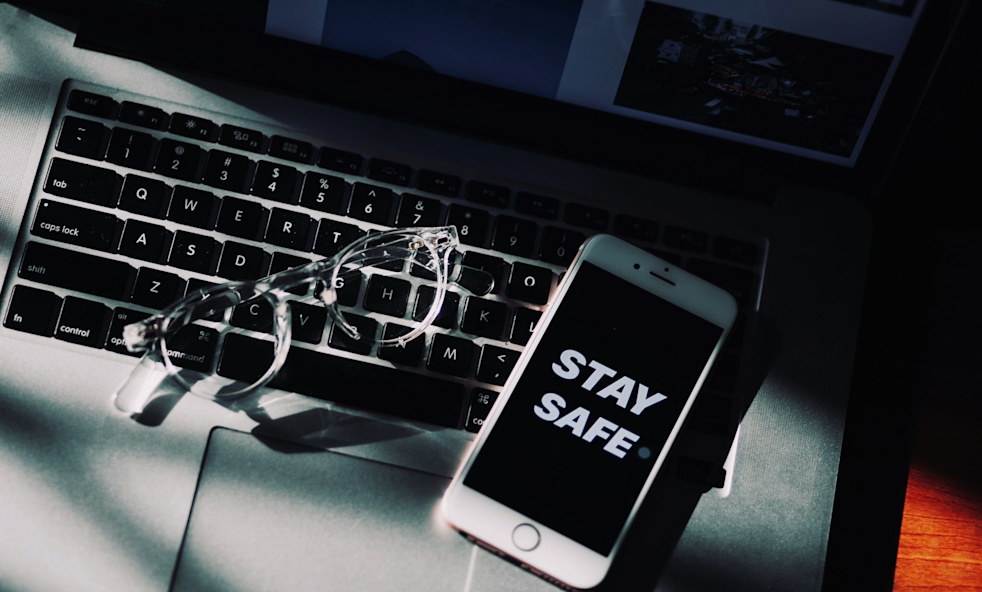 white-iphone-4-and-eyeglasses-on-a-laptop-4040961