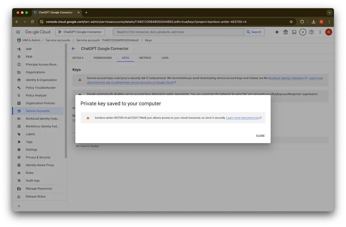 Google Cloud service account Keys tab with confirmation that a private key JSON file was saved to the computer