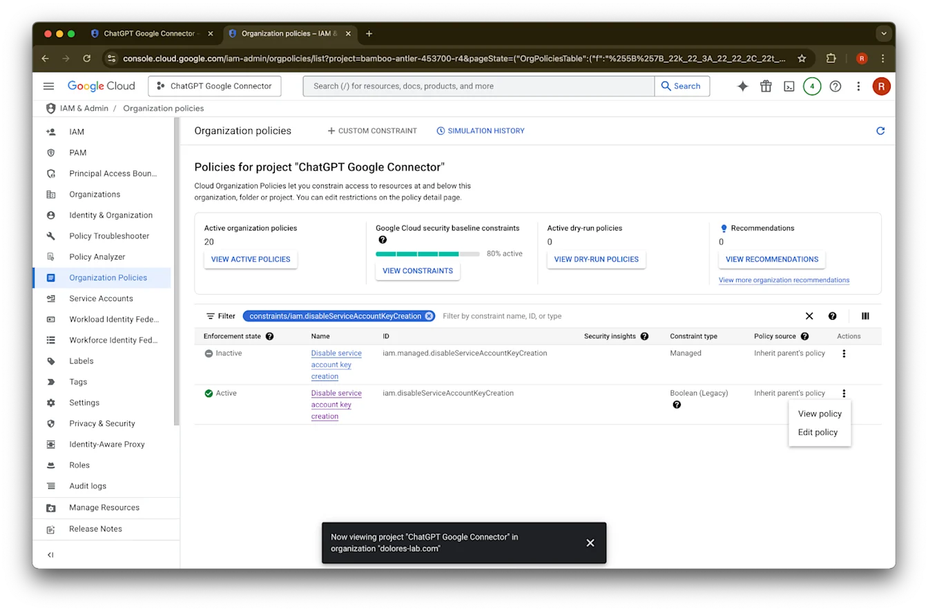 Google Cloud Organization Policies filtered to Disable service account key creation with Edit policy menu open