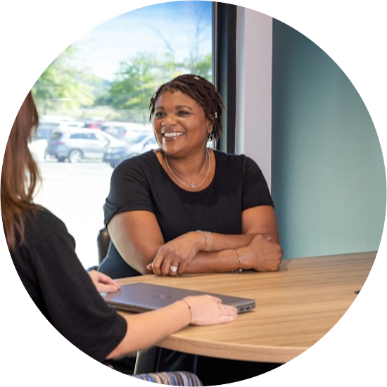 Clayton team members have a conversation