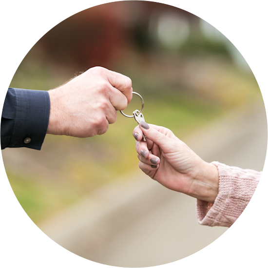 CHBG - Home retail sales person handing keys to a new homebuyer