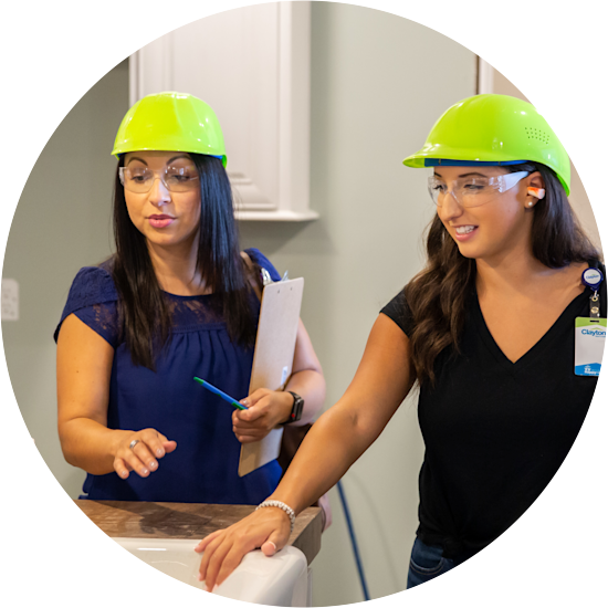 Two Clayton interns enjoy a visit to a facility.