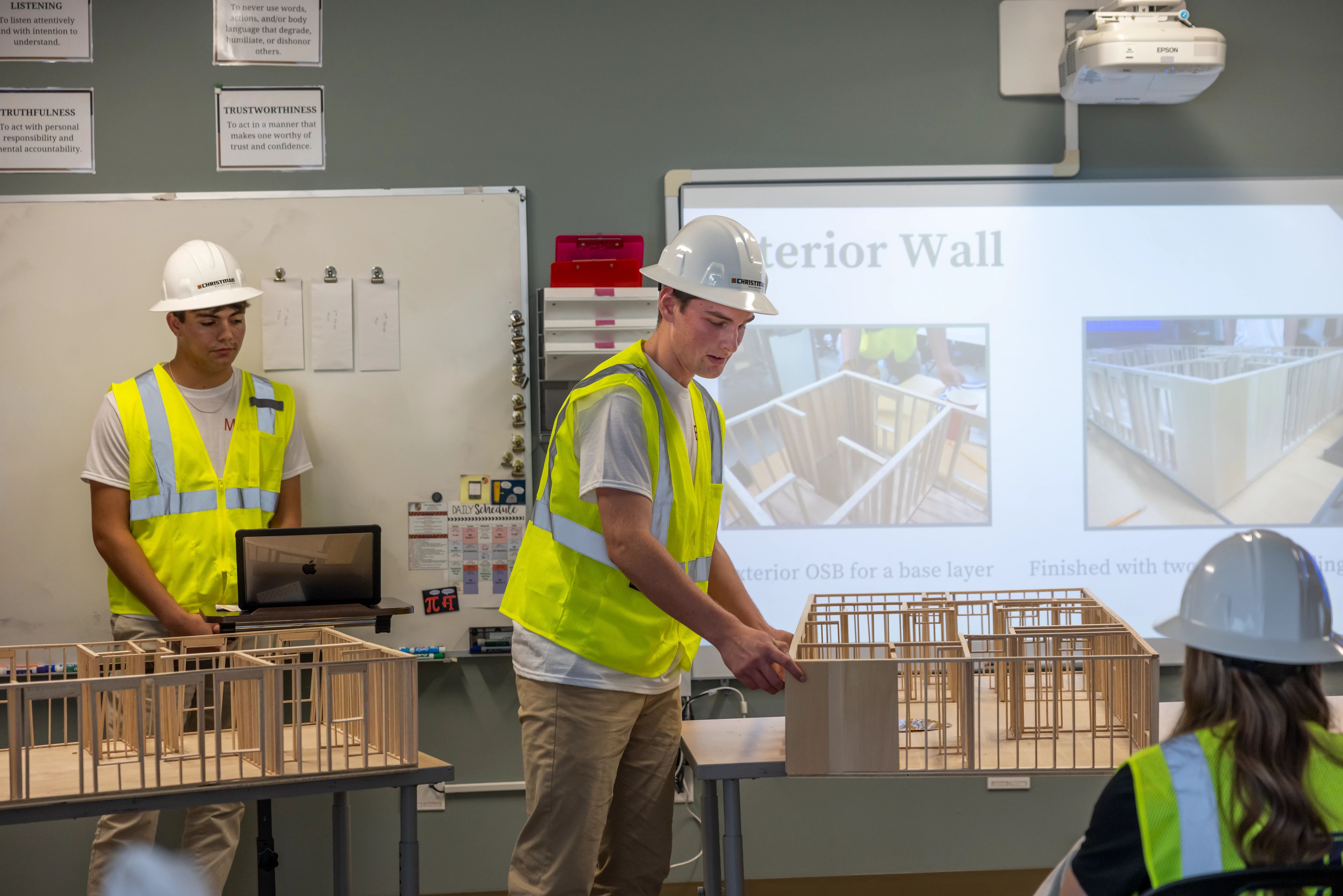 A Clayton-Bradley Academy student demonstrates his team's model