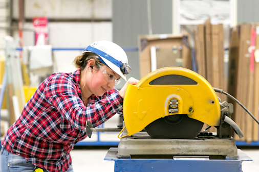 Clayton Home Building Group team member using a saw