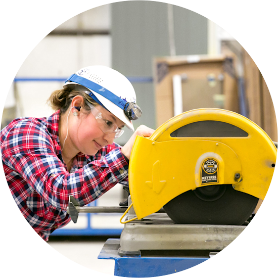 Clayton Home Building Group team member using a saw