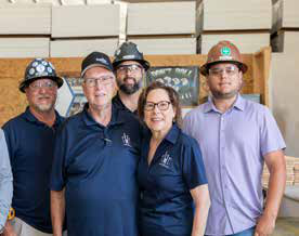 Clayton Addison II team members Carl Downey, Andrew Worley and Jayson Fere meet on-site with Sleep in Heavenly Peace volunteers Jerry Murray and Carolyn Murray.