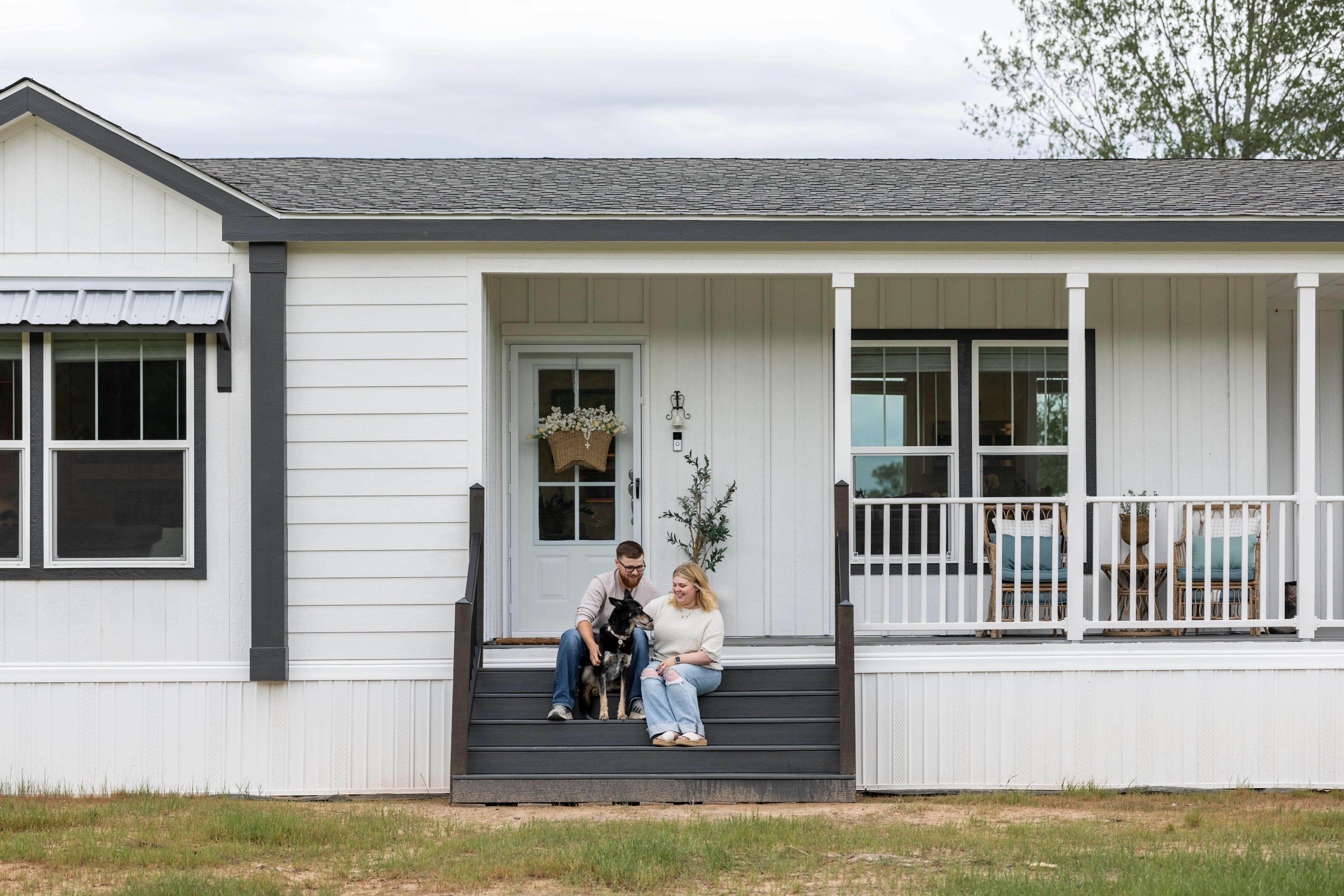 Homeowners on the front porch of a Sedona model home