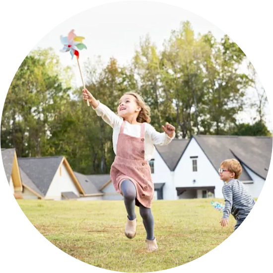 Young girl running in a neighborhood