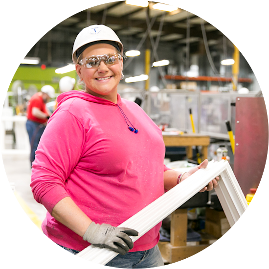 Female Clayton Supply Crossville Team Member posing with window frame