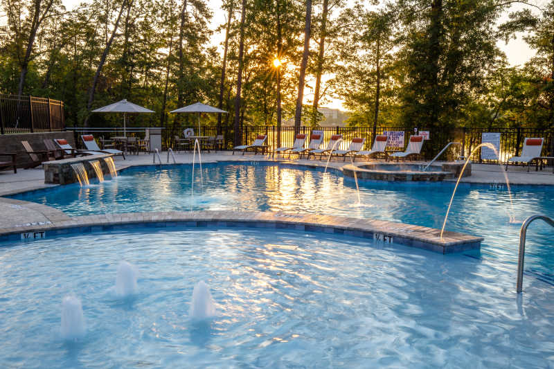 The sun rises over Lake Hartwell and the pool at Lakeside Lodge Clemson.