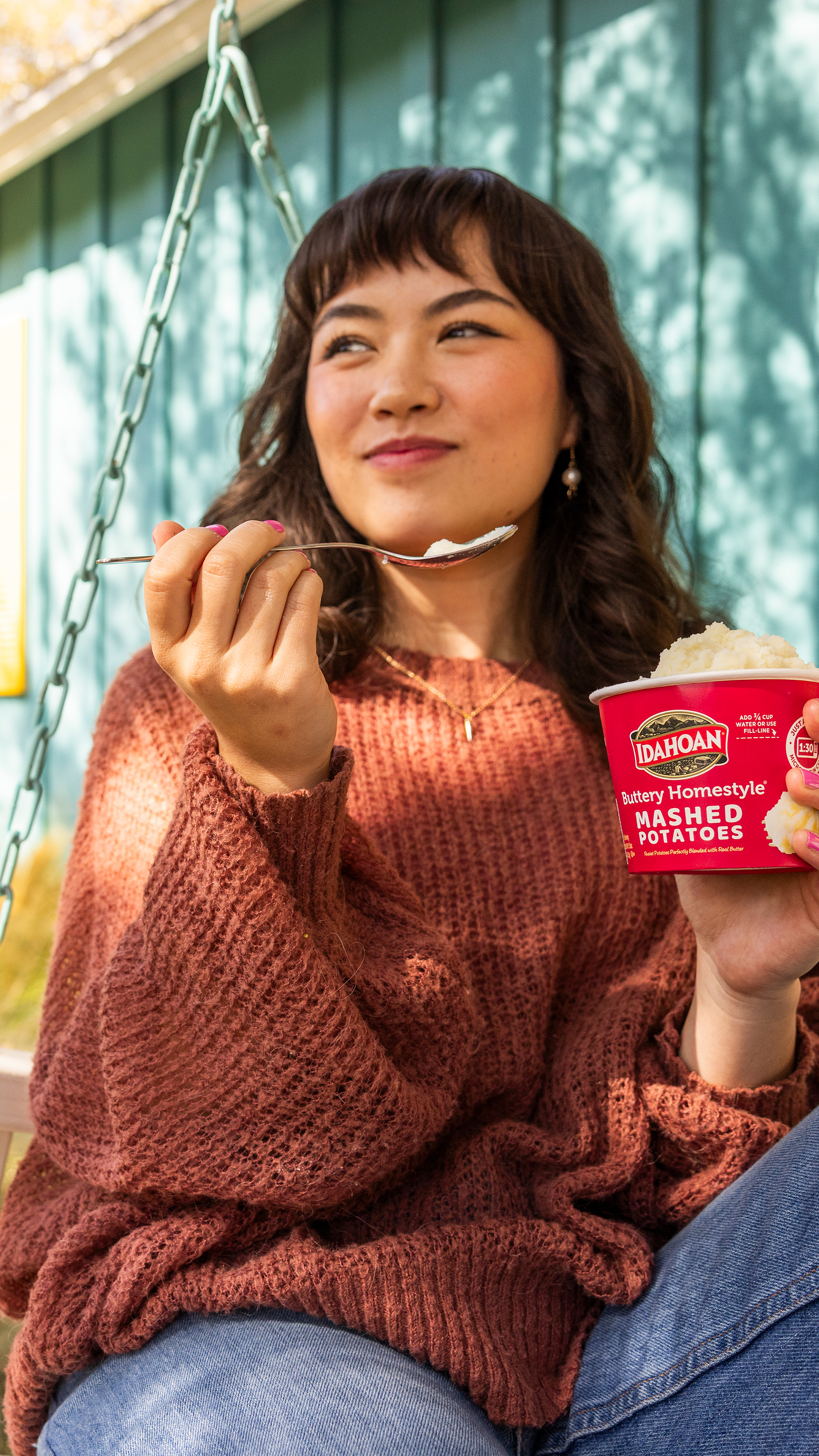 Woman enjoying Idahoan On-The-Go Cup