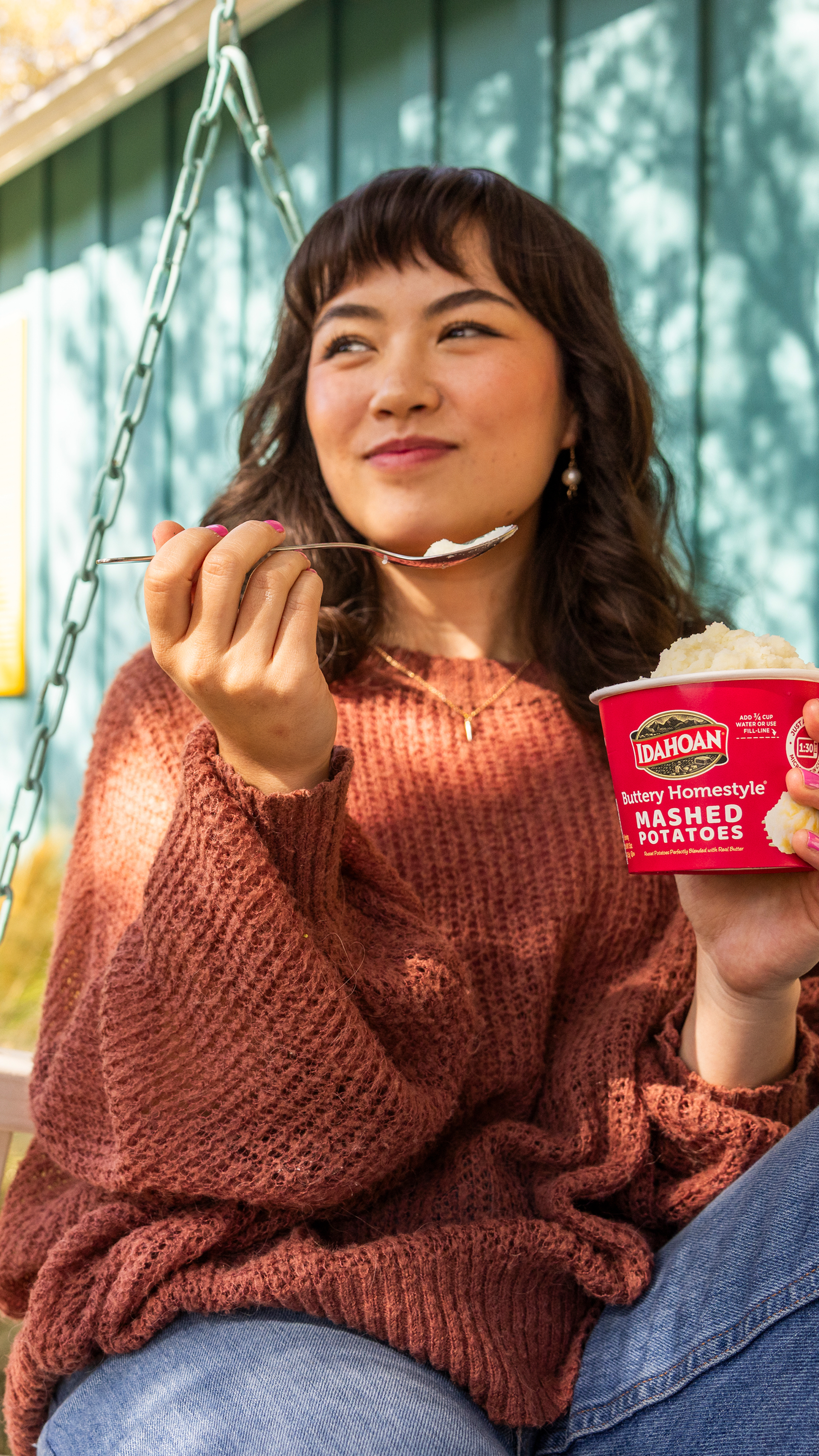 Woman enjoying Idahoan On-The-Go Cup