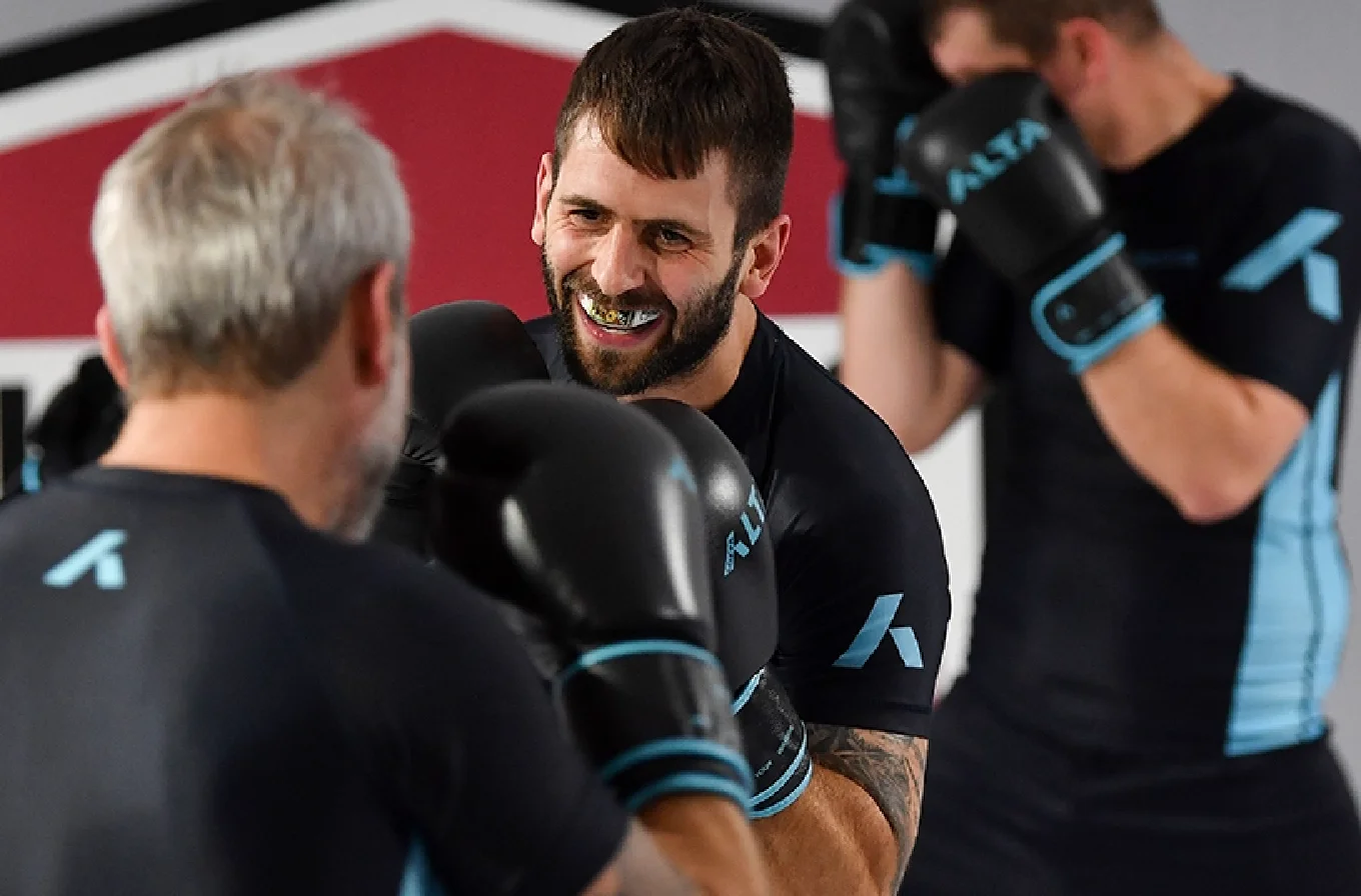 Men training martial arts in a gym 