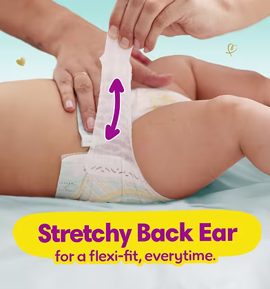 Woman putting a diaper on a baby