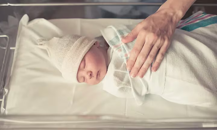 How do you swaddle a baby step by step