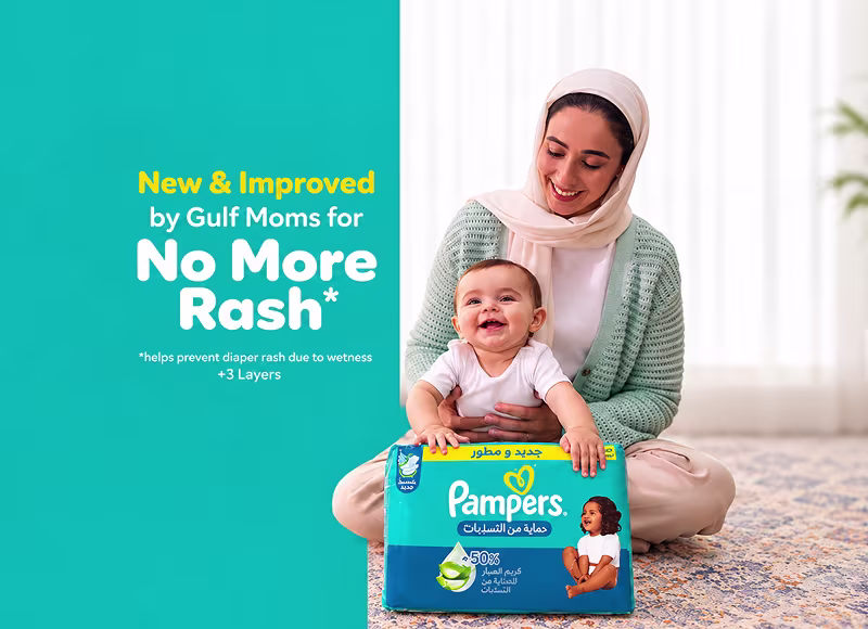 Mother and smiling baby with Pampers pack — new and improved by Gulf Moms for no more rash, helps prevent diaper rash due to wetness with 5 layers Mother and smiling baby with Pampers pack — new and improved by Gulf Moms for no more rash, helps prevent diaper rash due to wetness with 5 layers